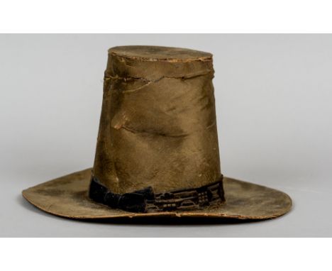 A 19th century Welsh ladies silk top hat
Of typical broad rimmed form, with a bow tied ribbon.  20 cm high.
 CONDITION REPORT