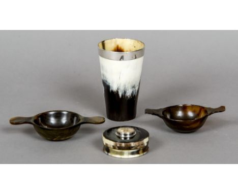 A Scottish horn snuff box
Of circular form, the lid inset with a fishing fly; together with a silver rimmed horn beaker; and 