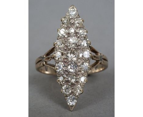 An 18 ct gold diamond cluster ring
Of lozenge form, with pierced shoulders. CONDITION REPORTS: Some inclusions, general wear,