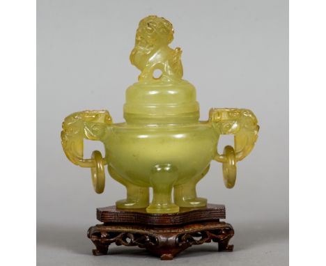 A Chinese carved jade censor and cover
The removable lid with a dog-of-fo finial above twin elephant mask and loop handles, s