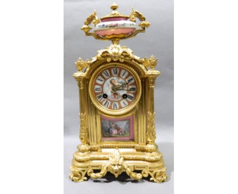 A 19th century Sevres type porcelain inset ormolu cased eight day mantel clock
The porcelain dial with Roman numerals centred