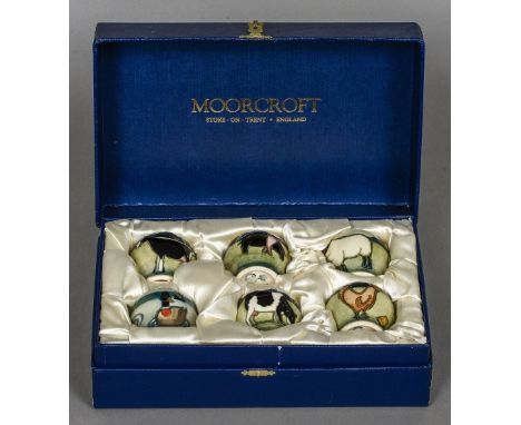 A boxed set of modern Moorcroft pottery egg cups, Farmyard pattern
Variously marked, boxed.  
