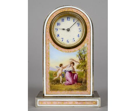 A pink enamel decorated desk clock
The white circular dial with Arabic numerals above a figural vignette depicting cupid.  9.
