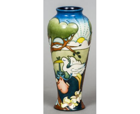 A modern Moorcroft pottery trial piece by Nicola Slaney
Tube lined decorated with a stork delivering a new born baby, signed,