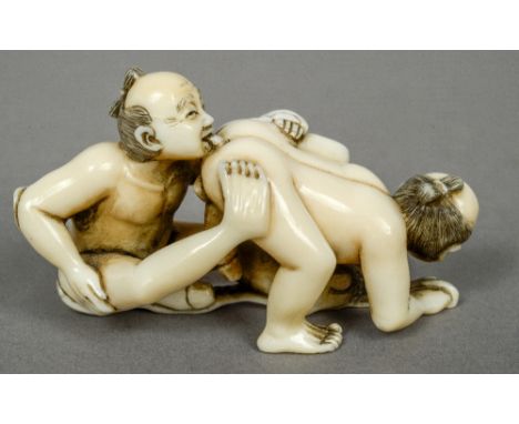 A Japanese ivory netsuke
Carved as two figures performing a homo-erotic act, the underside signed.  6.5 cm wide.  CONDITION R