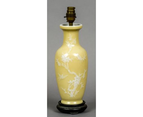 A Chinese porcelain vase, converted to a lamp base
Decorated in white slip with exotic birds on a cream ground, standing on a