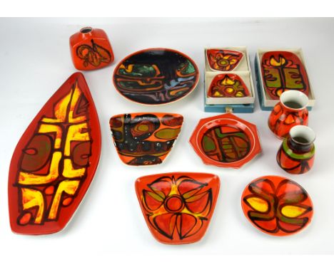 Poole Pottery, Delphis, a boat shaped dish, printed marks to base, 43.5cm long, together with two sections of a food set, a r