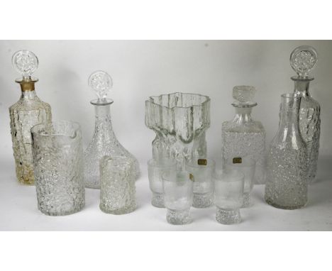 A collection of Whitefriars glass, to comprise a matched pair of decanters and stoppers, 34cm high, two other decanters and s