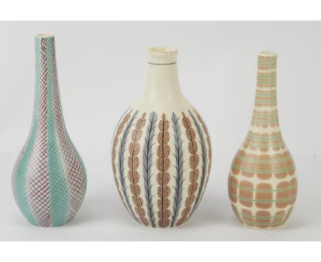 Poole Pottery, Freeform ovoid vase, pattern no. EX/YCB, impressed mark 689, 19cm high, and two bud vases, PQBA and X/PKT, 19.