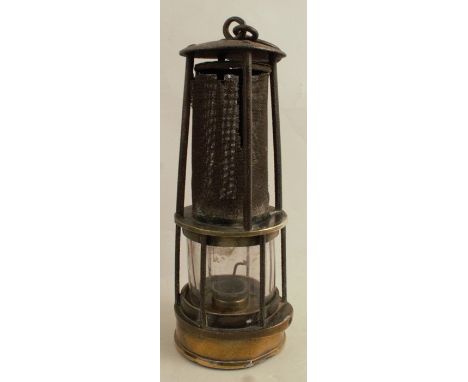 A 19th century brass miner's safety lamp, by Joseph Cooke of Birmingham, the gauze protected by four rods and the glass by si