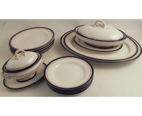 A Royal Worcester part dinner service, decorated with a blue edge and printed band, comprising two graduated meat plates, 19i