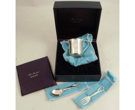 Tiffany &amp; Co, a silver christening set, with stamped marks and T&amp;Co, London hallmark 1999, comprising a mug, spoon an