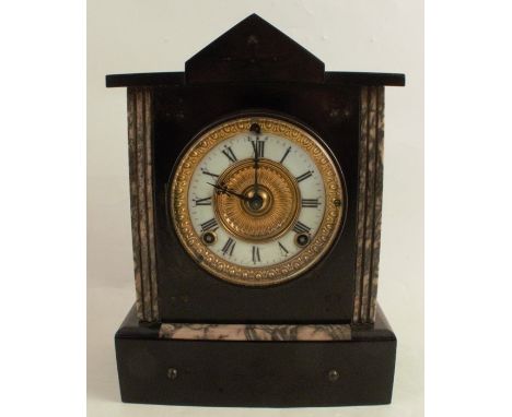 A Victorian black slate mantel clock, with marble inlay to the architectural case, the movement stamped Ansonia Clock Co New 