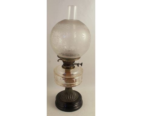 A Victorian oil lamp, with etched glass shade, glass oil reserve on a gilt metal column, height 22ins
