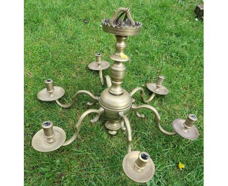 A brass six light chandelier, height 16ins x diameter 21.5ins