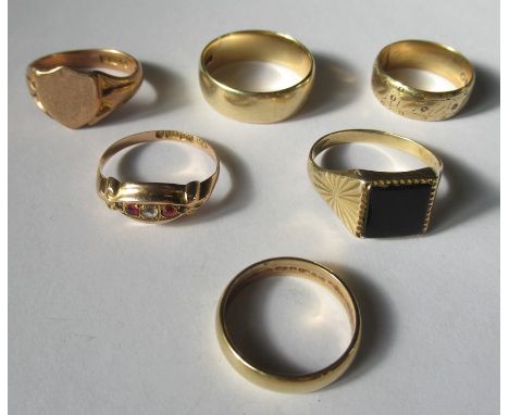 A collection of six 9 carat gold rings, comprising, three wedding rings, an onyx ring, a signet ring, and a stone set ring, 2