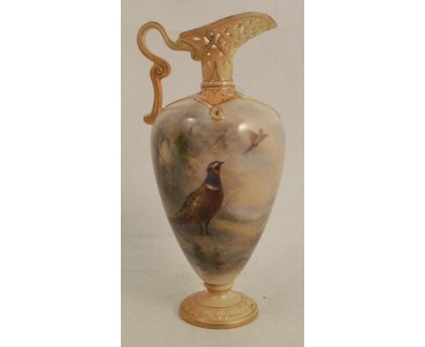 A Royal Worcester ewer, with blush ivory pierced spout, handle and foot, the body decorated with pheasants in landscape by Ja