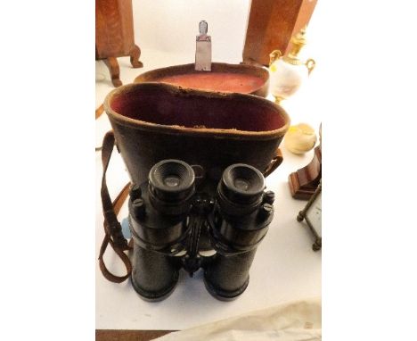 A pair of cased Bar and Stroud 7x binoculars, serial number 54373, with military arrow head, the cased marked First Lieut