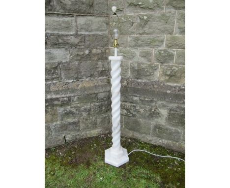 An alabaster standard lamp, having a turned column on a stepped octagonal base, height 36ins