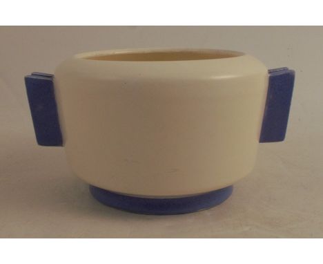A 1930's Art Deco Poole Pottery Plane Ware footed bowl, with vertical two line handles, a cream body with blue handles and fo