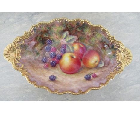 A Royal Worcester oval shaped dish, decorated all over with hand painted fruit by H Ayrton, to a gilt gadroon border with she