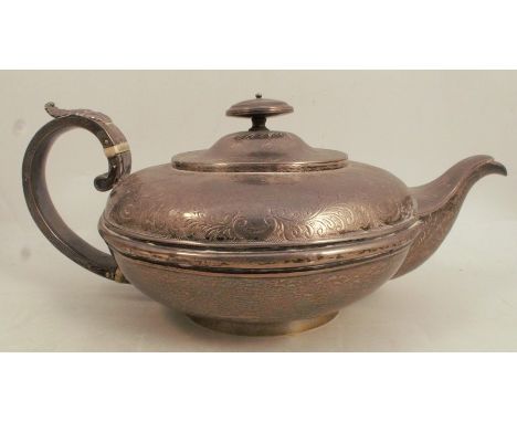 A Georgian silver teapot, of squat circular form , with engraved decoration to the upper body, London 1828, weight 17oz all i