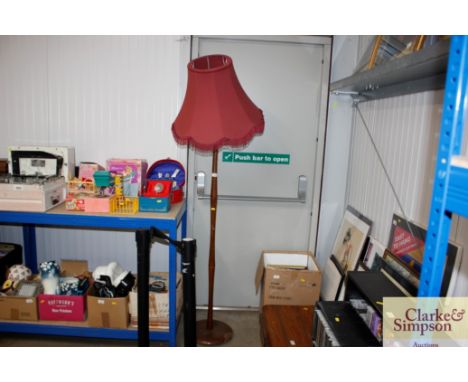 A turned standard lamp and shade