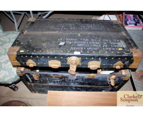 A brass bound travelling trunk and contents of various pictures, prints, mirrors etc
