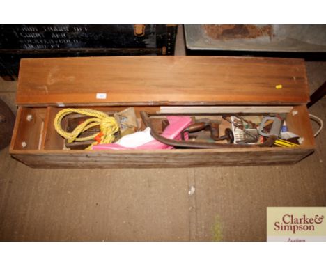 A wooden oblong storage box and contents of various carpenters tools etc