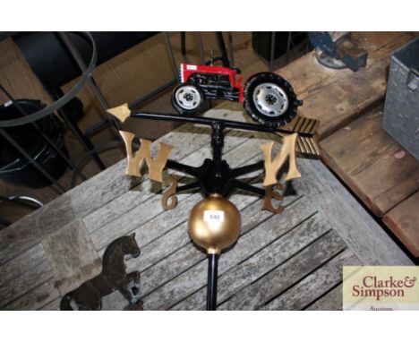 A weather vane decorated with a tractor (82)