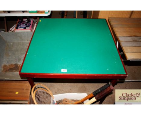 A folding card table