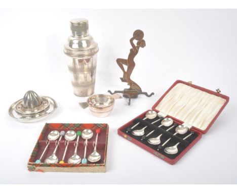A collection of 20th Century art deco items to include two boxed sets of six bean end coffee spoons, a silver plated tea stra