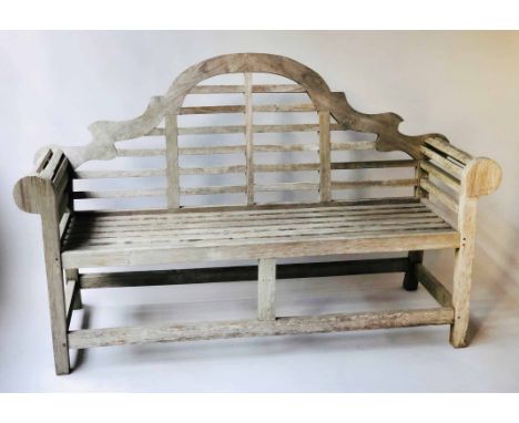 GARDEN BENCH, silvery weathered teak, of slatted construction, after a design by Sir Edwin Lutyens, 170cm W.