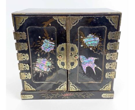 TABLE TOP CABINET, Japanese Meiji period circa 1900, mother of pearl inlaid panel doors enclosing an arrangement of five draw