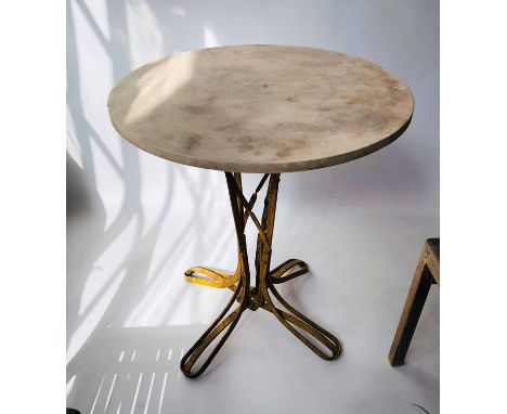 GARDEN TABLE, 19th century French, with circular weathered travertine marble top, above a yellow painted bentwood, wrought ir