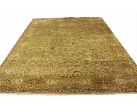 FINE SAFAVID AGRA CARPET, 305cm x 244cm, all over palmette and vine design within corresponding borders.