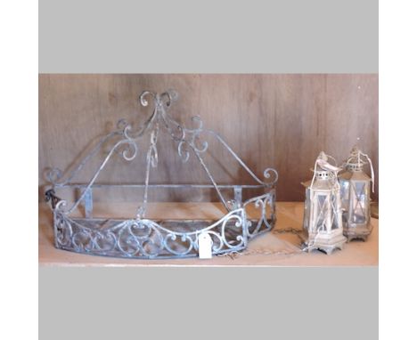 An iron wall bracket, 81cm, together with an iron sconce, two lanterns and a metal plaque