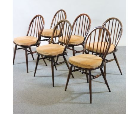 A set of six Ercol dark elm dining chairs