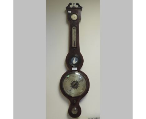 A 19th century mahogany cased wheel barometer, with a silvered dial, 96cm tall