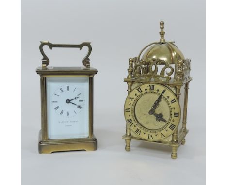 A brass cased carriage clock, the enamelled dial signed Matthew Norman, London, 15cm tall overall, together with a brass lant