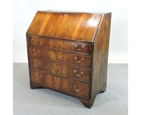 An 18th century walnut bureau, on bracket feet, 90cm