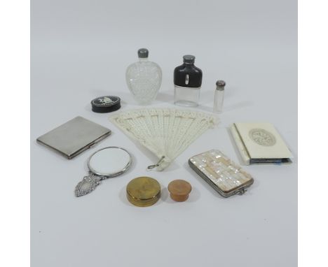 A collection of items to include a mother of pearl purse, a silver cigarette case, hipflask, notebook, scent bottles, trinket
