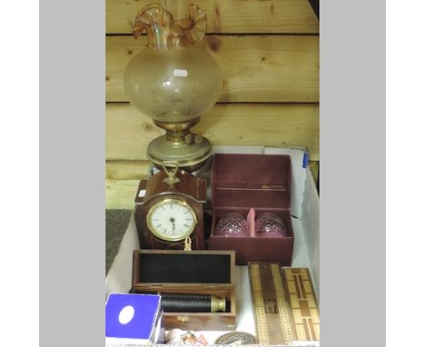 A mahogany and inlaid mantel clock, together with a brass oil lamp, with an etched glass shade, a telescope, cribbage boards 