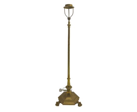 20th century brass finished floor lamp, telescopic stem on a shaped hexagonal platform base, raised on ball and claw feet (lo