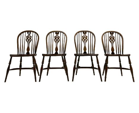 Set four oak Windsor chairs, hoop and stick back with pierced splat, dished seats on turned supports with crinoline stretcher