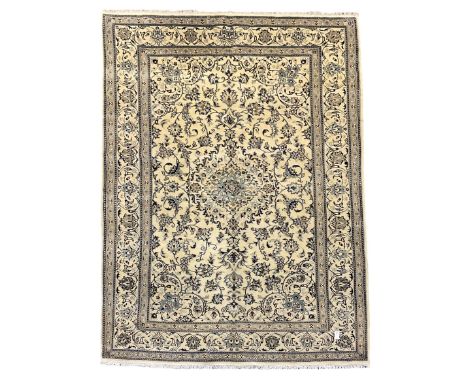 Central Persian Nain rug, wool with silk inlay, ivory ground decorated with scrolling and interlaced branch with stylised pla