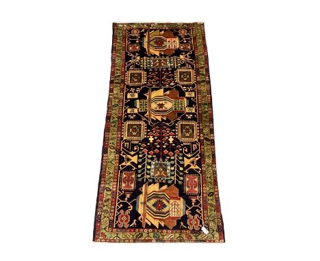 North West Persian Heriz Kelleh rug, the blue ground field with large stylised plant medallions, decorated with flower head, 