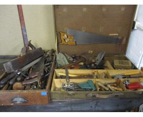 A collection of tools to include wood working planes, saws, chisels and other items 