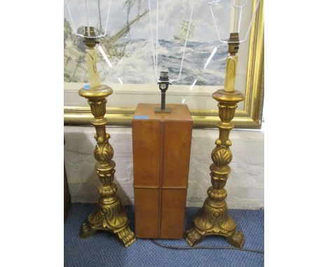 A modern brown leather lamp, together with a pair of gilt decorated side lamps 