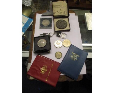 A mixed lot of coins and medals to include an RMS Lusitania medal, Britains First Decimal Coins pack, commemorative coins and